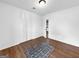 Bright bedroom with hardwood floors, large closet, and minimalist decor at 2800 Chelsey Trl, Jonesboro, GA 30236