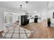 Open concept kitchen and living space with modern vinyl floors and ample natural light at 2800 Chelsey Trl, Jonesboro, GA 30236