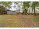 Backyard featuring a wooden playset, a storage shed, and a fenced yard at 6140 Ginn Se St, Covington, GA 30014