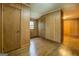 Bedroom with wood paneled walls and hardwood floors at 6140 Ginn Se St, Covington, GA 30014