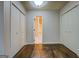 Bedroom featuring hardwood floors, white walls, and closet space at 6140 Ginn Se St, Covington, GA 30014