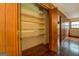 Spacious closet with shelving, providing ample storage in a wood-paneled room at 6140 Ginn Se St, Covington, GA 30014