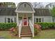 A close exterior view of the home's entrance and well-maintained landscaping at 6140 Ginn Se St, Covington, GA 30014