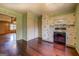 Kitchen with hardwood floors, white cabinets, and access to laundry space at 6140 Ginn Se St, Covington, GA 30014
