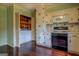 Kitchen with wooden floors, built in appliances, and a hidden laundry at 6140 Ginn Se St, Covington, GA 30014