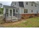 Rear porch showcasing a small deck, brick trim, and the structure of the house at 6140 Ginn Se St, Covington, GA 30014