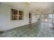 Large sunroom features tile flooring, ceiling fans, and plentiful natural light at 6140 Ginn Se St, Covington, GA 30014