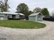 The well-maintained backyard has gravel pathways, an outbuilding, and a deck at 6121 N Main Se St, Acworth, GA 30101
