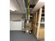 The unfinished basement has painted walls, exposed duct work, and painted concrete floor at 6121 N Main Se St, Acworth, GA 30101