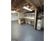 The unfinished basement has painted walls, a concrete floor, and a utility sink at 6121 N Main Se St, Acworth, GA 30101