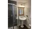 Updated bathroom with a glass shower enclosure and pedestal sink at 6121 N Main Se St, Acworth, GA 30101