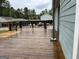 Wooden deck overlooking the backyard with wood-stained finish at 6121 N Main Se St, Acworth, GA 30101
