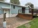 Exterior wooden deck with stone accents and a view of the backyard at 6121 N Main Se St, Acworth, GA 30101