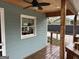 Covered wooden deck area with ceiling fan and view of the backyard at 6121 N Main Se St, Acworth, GA 30101