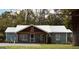 Charming single story home featuring metal roof, welcoming porch and classic curb appeal at 6121 N Main Se St, Acworth, GA 30101