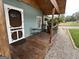 Cozy front porch with dark wood flooring and seating. Great for relaxing outdoors at 6121 N Main Se St, Acworth, GA 30101