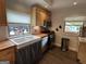 Charming kitchen with stainless appliances, farmhouse sink and wood counters at 6121 N Main Se St, Acworth, GA 30101