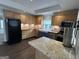 Kitchen featuring island, wood counters, farmhouse sink, stainless appliances, and wood cabinets at 6121 N Main Se St, Acworth, GA 30101