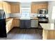 Kitchen featuring wood counters, farmhouse sink, stainless appliances, and wood cabinets at 6121 N Main Se St, Acworth, GA 30101