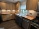 Bright kitchen featuring wood counters, mosaic backsplash, farmhouse sink, stainless appliances, wood cabinets at 6121 N Main Se St, Acworth, GA 30101