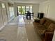 The living room features neutral walls, carpet, and great natural light at 6121 N Main Se St, Acworth, GA 30101