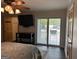 Main bedroom featuring sliding glass doors to the backyard deck at 6121 N Main Se St, Acworth, GA 30101