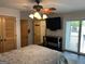 Main bedroom featuring two closets and sliding glass doors to the backyard at 6121 N Main Se St, Acworth, GA 30101
