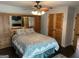 Comfortable main bedroom featuring built in storage and a decorative ceiling fan at 6121 N Main Se St, Acworth, GA 30101
