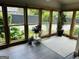 Enclosed sunroom with wood trim windows, offering lots of natural light at 6121 N Main Se St, Acworth, GA 30101