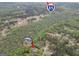 Expansive aerial view of wooded neighborhood with access to Interstate 85 and a beautiful two-story home at 70 Barrington Farms Ct, Sharpsburg, GA 30277