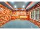 Spacious basement area features wood paneled walls and gray epoxy flooring at 70 Barrington Farms Ct, Sharpsburg, GA 30277