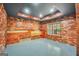 Basement area boasts wooden accent walls and an epoxy finished floor at 70 Barrington Farms Ct, Sharpsburg, GA 30277