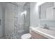 Modern bathroom showcasing a glass door shower and a single sink vanity with stylish fixtures at 70 Barrington Farms Ct, Sharpsburg, GA 30277