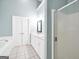 Well-lit bathroom with a double sink vanity, soaking tub, and a separate glass door shower at 70 Barrington Farms Ct, Sharpsburg, GA 30277