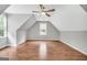 Large bedroom with a vaulted ceiling and two windows, offering abundant natural light at 70 Barrington Farms Ct, Sharpsburg, GA 30277