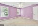 Bright bedroom with windows, carpet and a ceiling fan at 70 Barrington Farms Ct, Sharpsburg, GA 30277