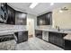 Modern kitchen with granite counters, stainless steel appliances, and dark wood cabinetry at 70 Barrington Farms Ct, Sharpsburg, GA 30277