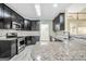 Modern kitchen with granite counters, stainless steel appliances, and plenty of counter space at 70 Barrington Farms Ct, Sharpsburg, GA 30277