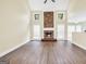 Vaulted living room featuring a stone fireplace, hardwood flooring, and lots of natural light at 70 Barrington Farms Ct, Sharpsburg, GA 30277