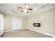 Main bedroom features neutral walls, a trey ceiling, access to a deck, and a fireplace at 70 Barrington Farms Ct, Sharpsburg, GA 30277