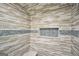 Walk-in shower with decorative tile details and a built-in bench at 70 Barrington Farms Ct, Sharpsburg, GA 30277