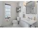 Charming bathroom featuring classic fixtures, black and white tile floor, and natural light at 140 Newhaven Dr, Fayetteville, GA 30215