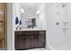 Stylish bathroom featuring a vanity with marble countertop and a tiled shower at 140 Newhaven Dr, Fayetteville, GA 30215