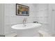Elegant bathroom featuring a freestanding tub, wainscoting, and classic fixtures at 140 Newhaven Dr, Fayetteville, GA 30215