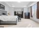 Serene bedroom with a comfortable bed, dresser, and natural light from the window at 140 Newhaven Dr, Fayetteville, GA 30215