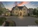 Stately home with a circular driveway, manicured landscaping, and elegant architectural details at 140 Newhaven Dr, Fayetteville, GA 30215