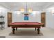 Classic game room showcasing a beautiful pool table with decorative accents and lighting at 140 Newhaven Dr, Fayetteville, GA 30215