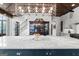 Kitchen with a marble island, stainless steel appliances, custom cabinets, display cabinet, and wooden ceiling at 140 Newhaven Dr, Fayetteville, GA 30215