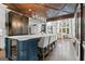 Kitchen with an island, stainless steel appliances, custom cabinets, display cabinet, and designer lighting at 140 Newhaven Dr, Fayetteville, GA 30215