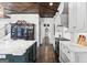 Kitchen with an island, stainless steel appliances, custom cabinets, display cabinet, and wooden ceiling at 140 Newhaven Dr, Fayetteville, GA 30215